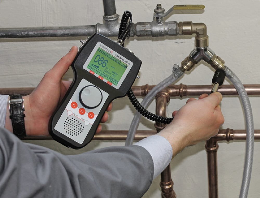 Plumber testing pipes with electronic leak detection equipment in Upper Darby