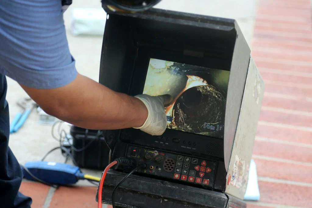 Technician viewing a drain inspection camera in Upper Darby